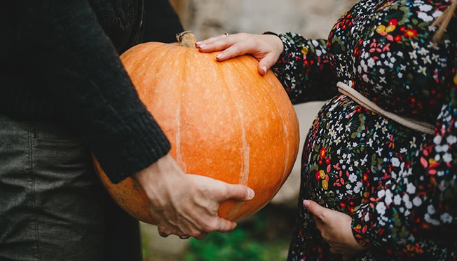 pregnant lady with a pumpkin